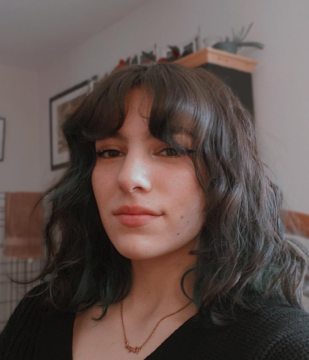 A head shot of a girl smiling at the camera.