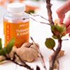 A bottle of turmeric and ginger supplements