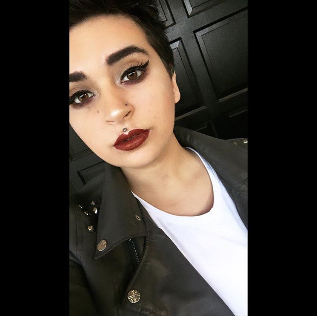 Makeup Look with black eyeliner and red lipstick.