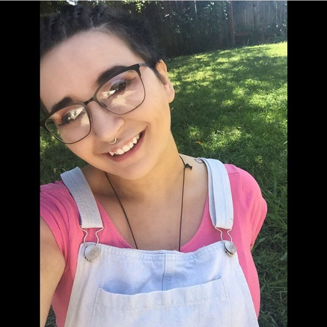 Smiling selfie in the grass.