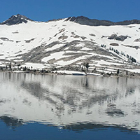 Aloha Lake with snowy granite face reflecting on lake