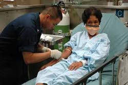 doctor checking patients blood levels