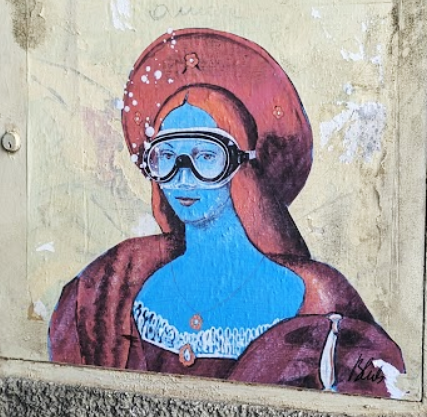 A graffiti mural of a stylized mona lisa wearing a scuba mask.