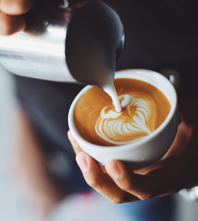 Barista making latte art