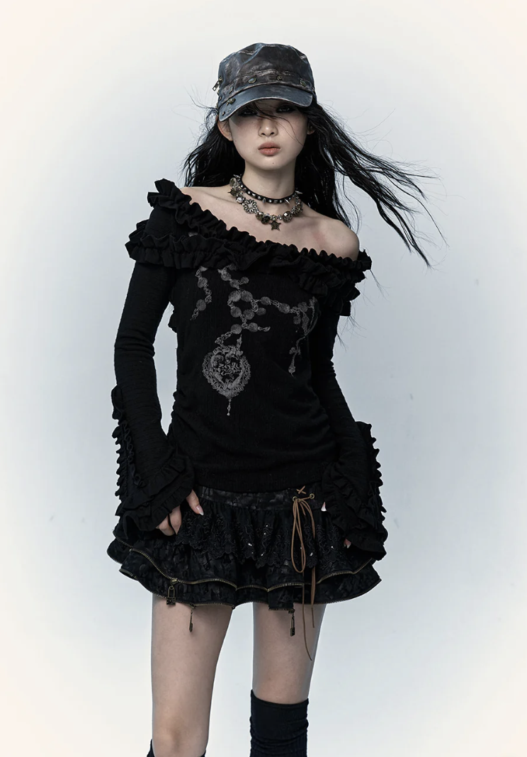 woman wearing a top and scarf with black and white stripes