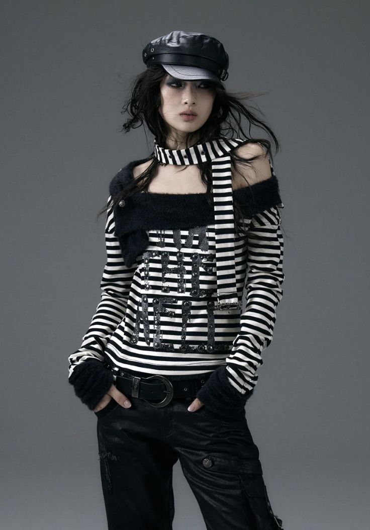 woman wearing black and white long sleeve off the shoulder top