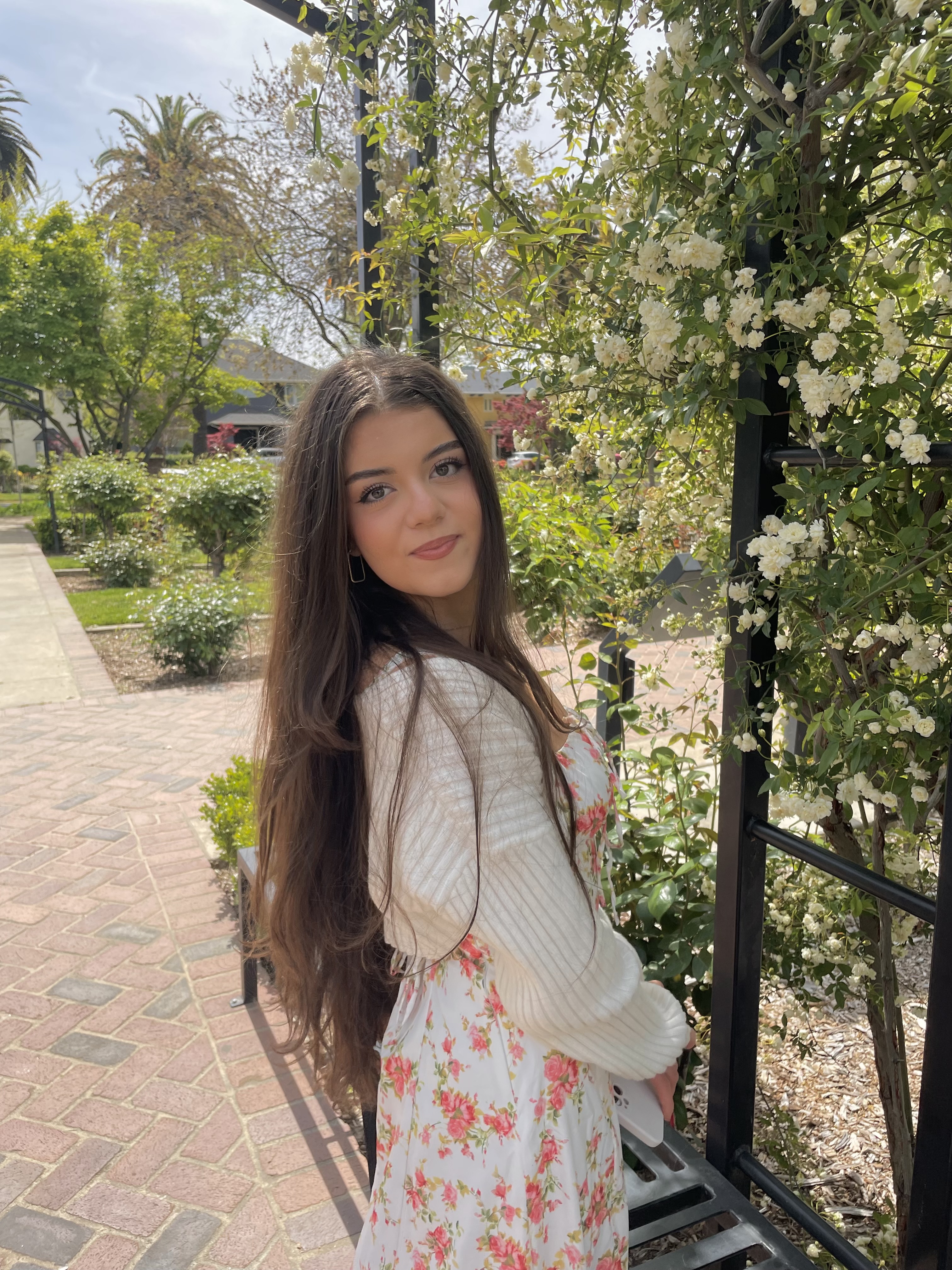marina standing in front of flowers