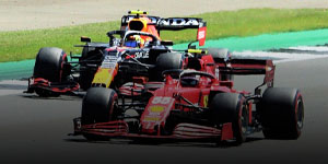 Photo of Ferrari driver Carlos Sainz overtaking Red Bull driver Sergio Perez on the track
