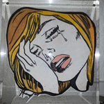 This picture is of an image of a comic book character. The character is drawn crying with their head in their hand. 