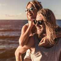 couple, beach, playful, sunglasses, happy couple, great skin couples