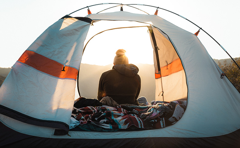 tent view with moutains and sunrise