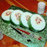 A cake that looks like four pieces of sushi rolls. Click here for a larger picture.