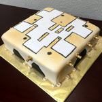 A cake that looks like a piece of machinery. Click here to go to the business event cake section.