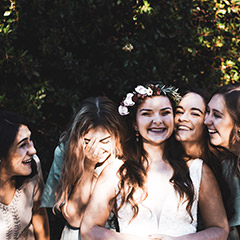 bride and birdesmaids laughing