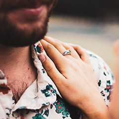 couple shoot hand with ring on shoulder