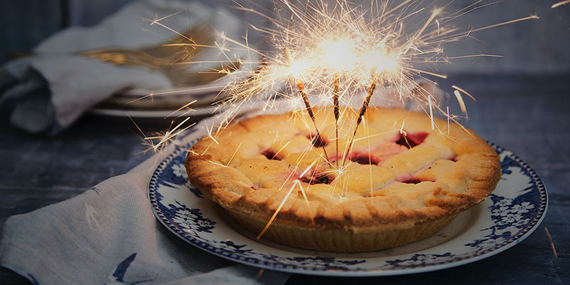 sparklers in a whole blueberry pie
