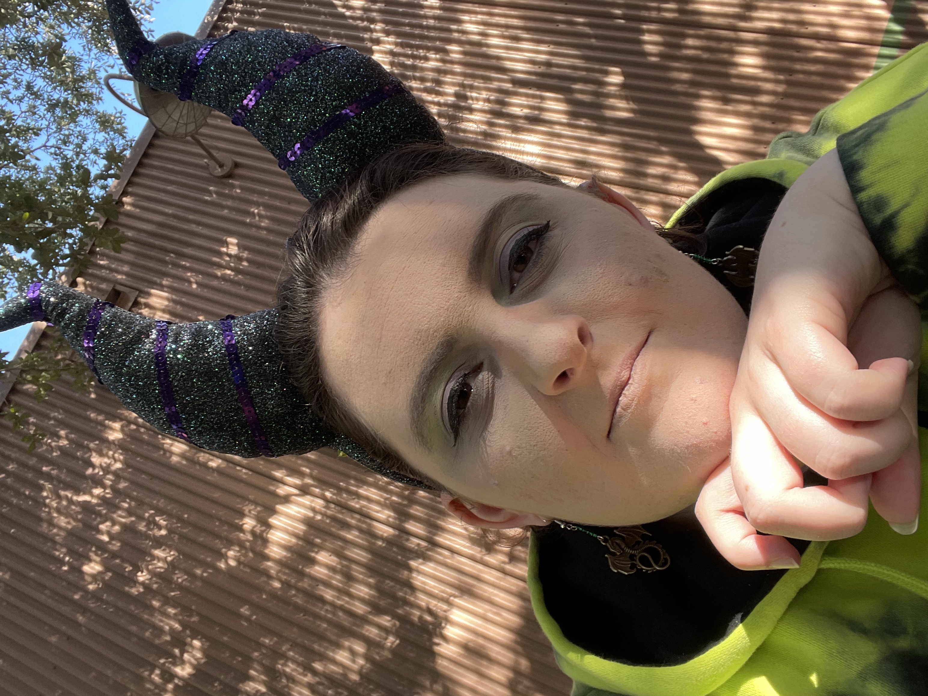 An image of Claire wearing Maleficient horns.