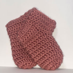 Rose colored crocheted ankle socks.