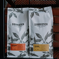 two bags of house coffee beans