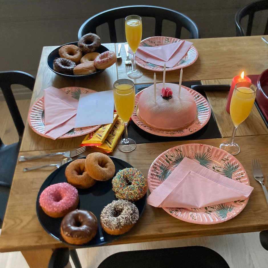 Birthday table setting with princess cake and donuts
