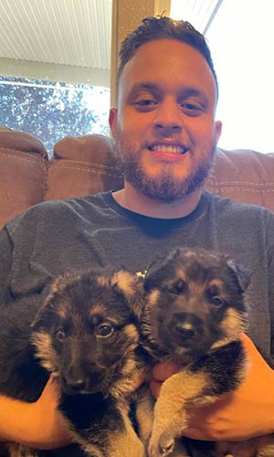Picture of me and two puppies