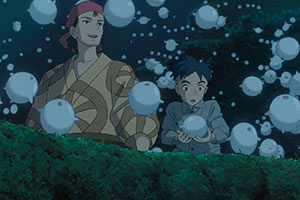 young boy and older woman setting tiny white beings into the air