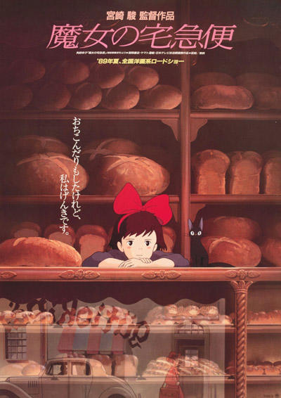 young girl with big red bow in hair behind the counter of a bread bakery