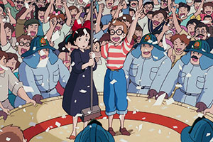 a young girl and boy with a crowd around them cheering