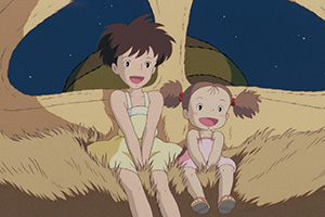 two young girls in a fluffy cat bus laughing