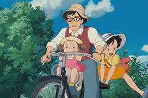 a father and his two daughers riding a bike together