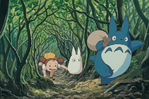 a young girl chasing forest spirits that look like rabbits
