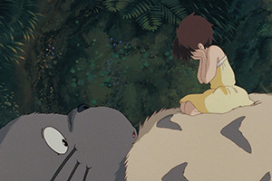 a young girl crying on top of a big fluffy forest spirit
