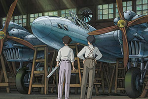 two men looking at planes in a shop