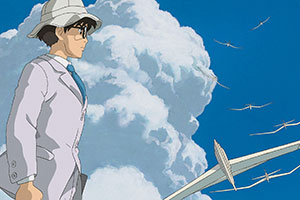 a man looking determined at the sky at places flying