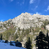 View of a rocky mountain with snow covered foreground 