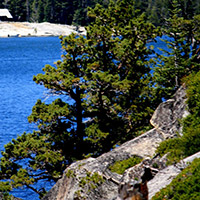 Large boulders, trees and Echo Lake in the background