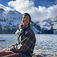 Girl sitting by Eagle Lake