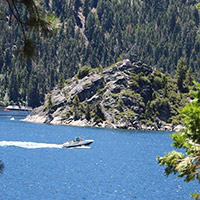 Speed boat passing Fannette Island in Emerald Bay