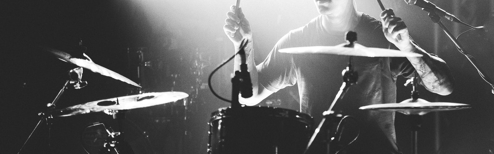 Person Playing Drums.