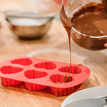 chocolate being pured into a mold
