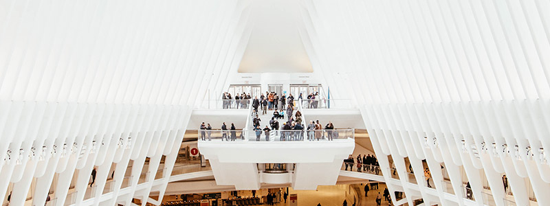 Shoppers walk around the Oculus