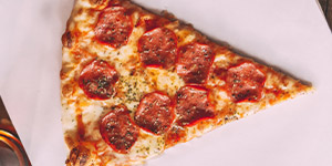 A slice of pepperoni pizza