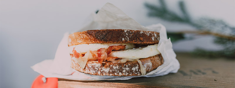 A sandwich with cheese and bacon