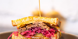 A sandwich cut in half to reveal the contents inside