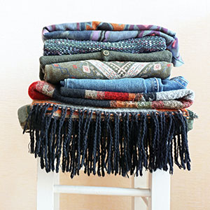stack of clothes on chair