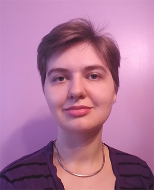 Selfie of a smiling woman with short hair.