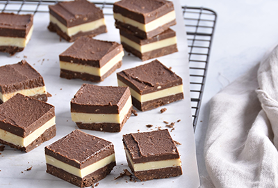Chocolate custard squares on a cooling rack
