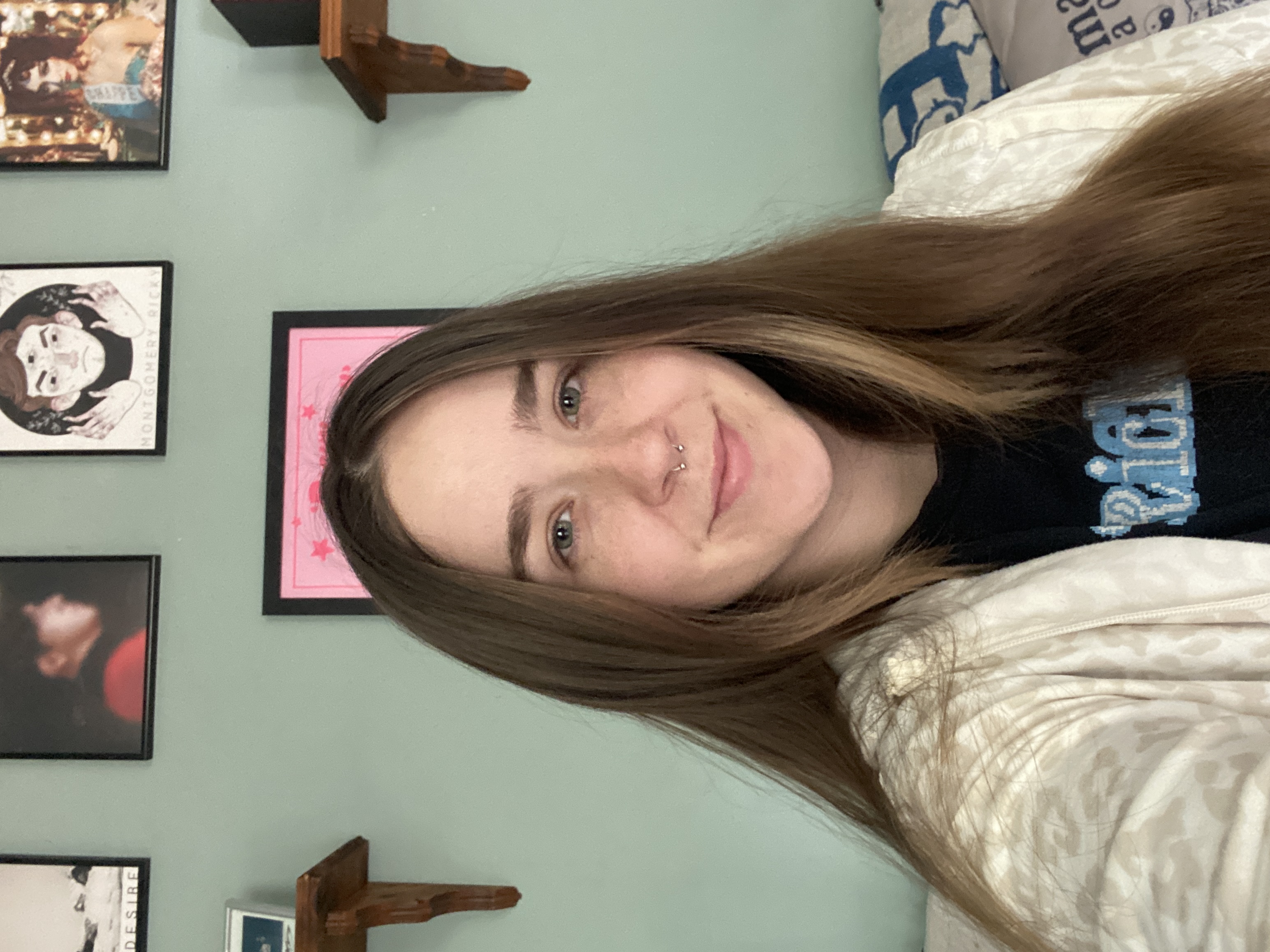 A selfie of Fiona in a light sweater and t-shirt 