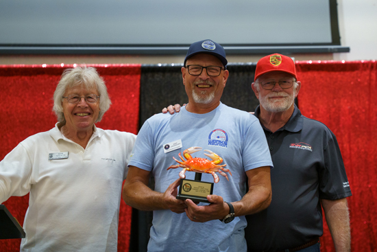 The King CRAB and two other PCA members smile for a photo. 