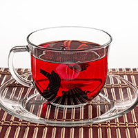Click on this image of a cup of tea in a clear cup and plate and you will get transferred to a page with more food photographs